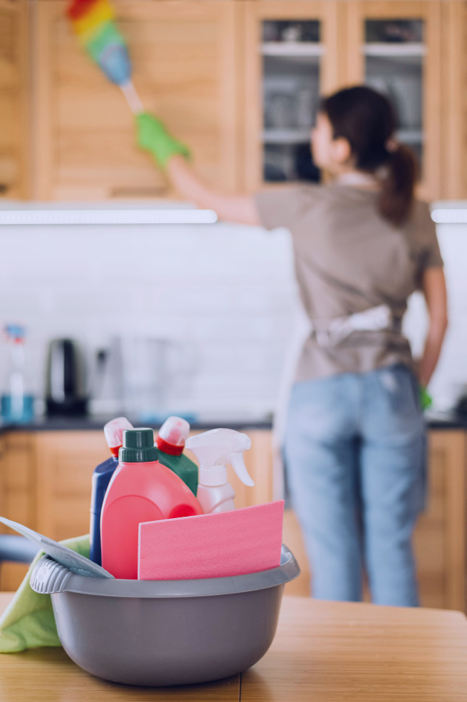 woman using fluffy duster