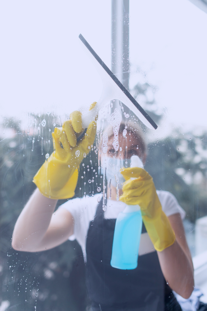 person taking care office cleaning